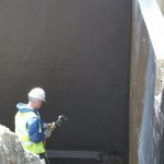 Bitumen sprayed onto the walls giving an even coating