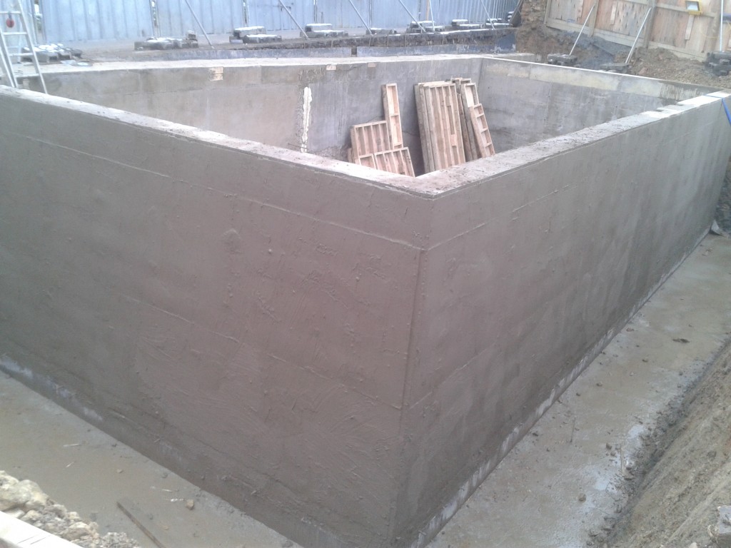Cementitious slurry applied externally