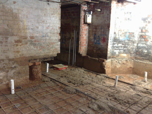 Steel rails used to ensure new floor is poured level