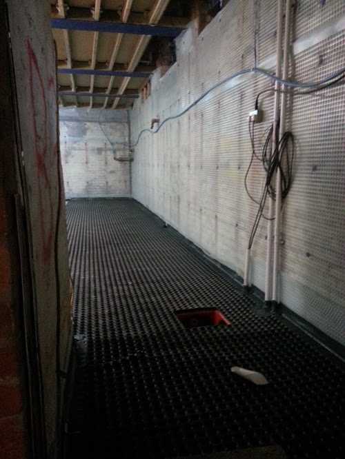 Pipework for pumps run under concrete floor and up the walls to a suitable discharge point
