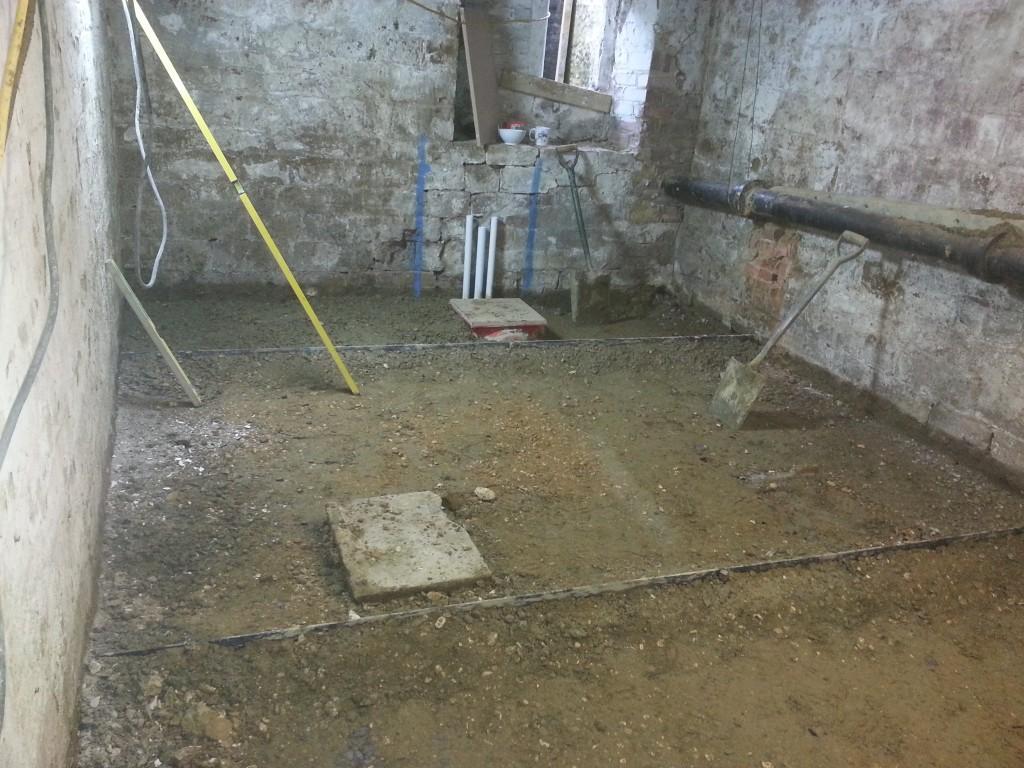 Old damp floor removed and replaced with new structural concrete slab