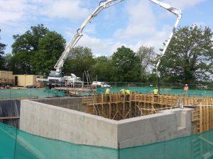 Large concrete pumps used to pour wall concrete