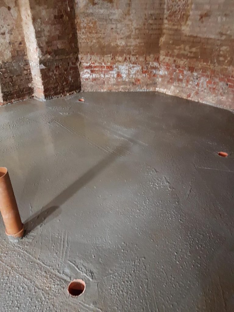 Underground drainage inlets cut at floor level to allow water to fall to the sump
