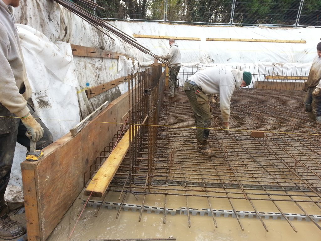 Reinforcing bars set out using string lines to allow continuity with the wall reinforcing above