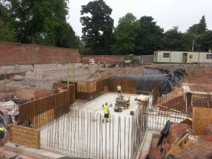 Walls constructed in two halves, the first being created with timber shutters