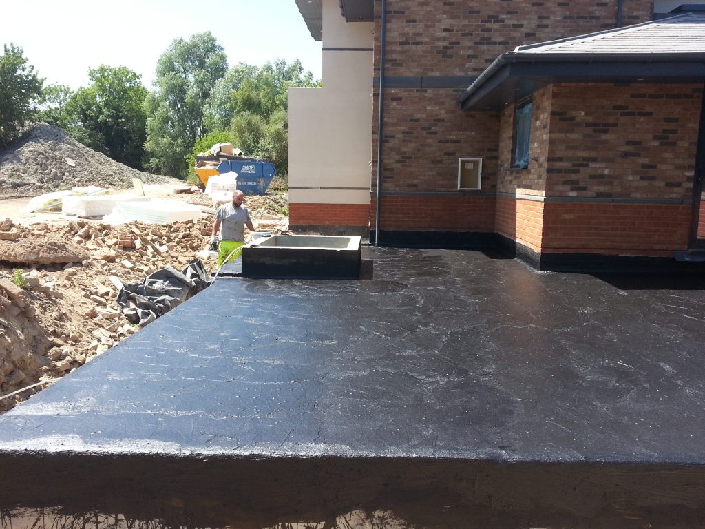 The whole deck surface is covered with laps up the walls and down past the edge to ensure continuity