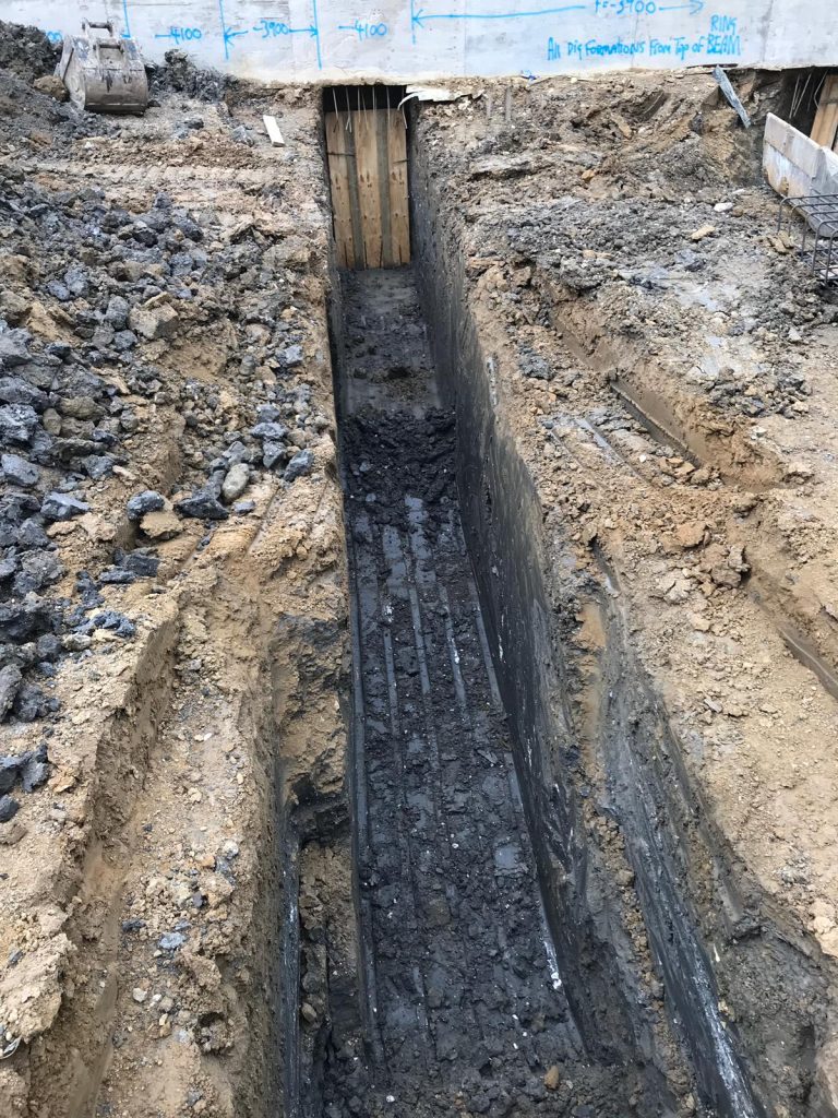 Excavation of 4m deep ground beams to support neigbours' properties