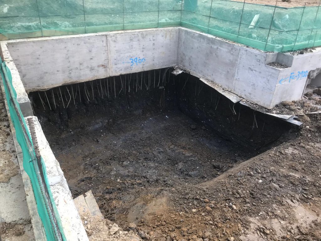 Excavation under the ring beam ready for underpinning